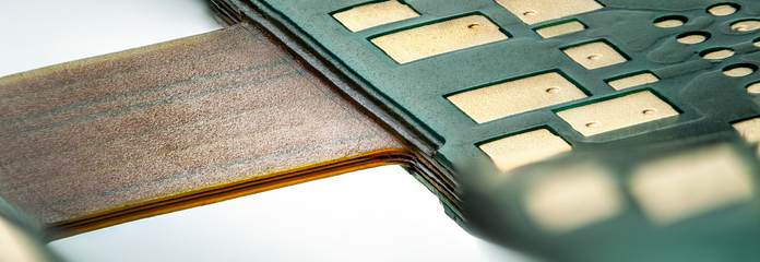 Multilayer flex PCB with openings to achieve rigid-flex properties.