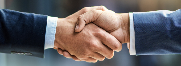 Handshake of two business people.